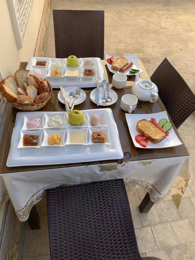 בוקורו Muslima Hotel מראה חיצוני תמונה